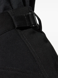 Close up of black pants, showing texture of the cotton fabric