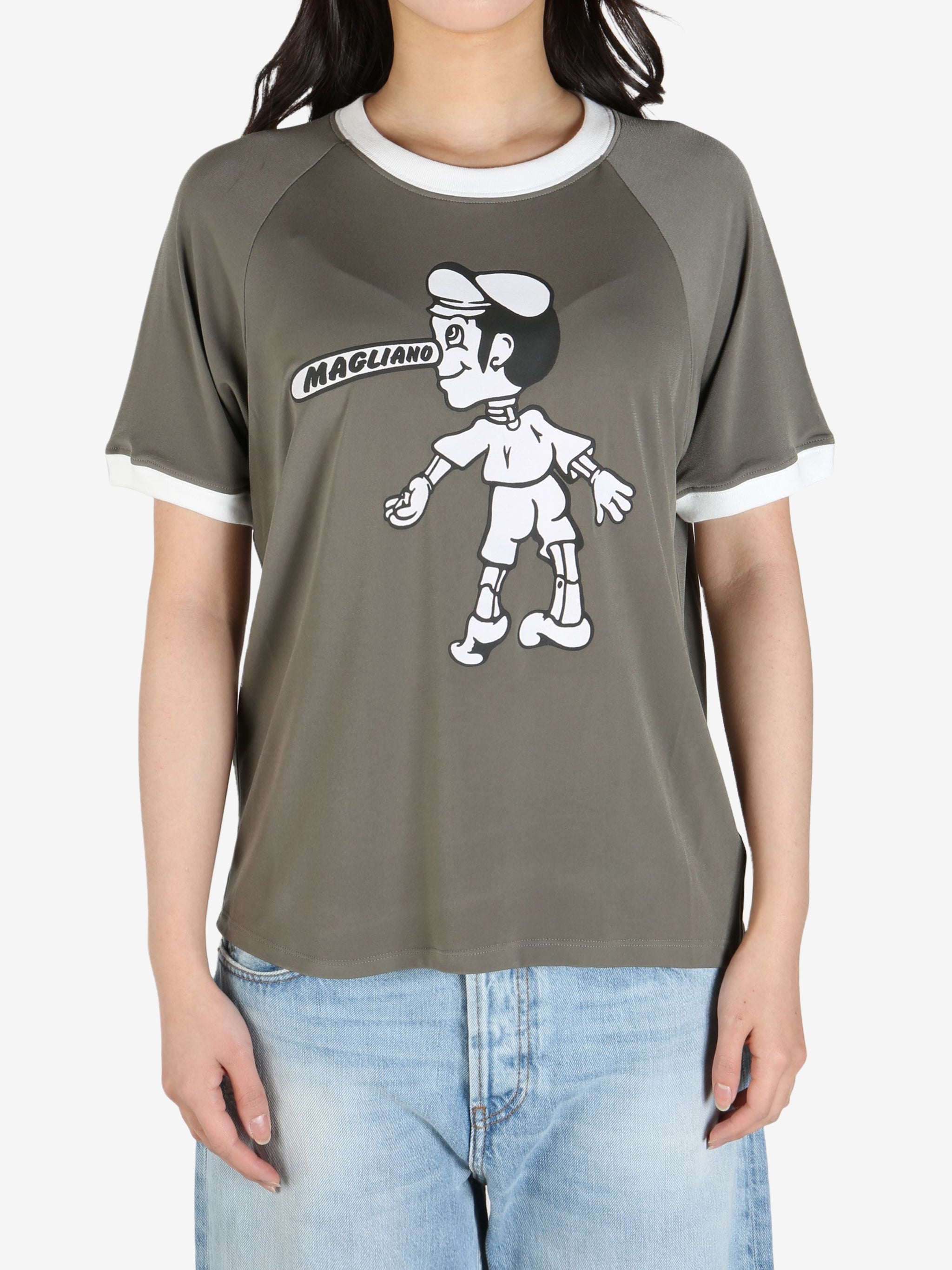 Grey tee worn by a person, showing the 
 tee's fit