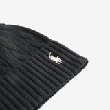 Close up of black hats, showing texture of the cashmere and wool fabric