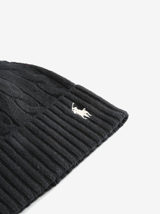 Close up of black hats, showing texture of the cashmere and wool fabric