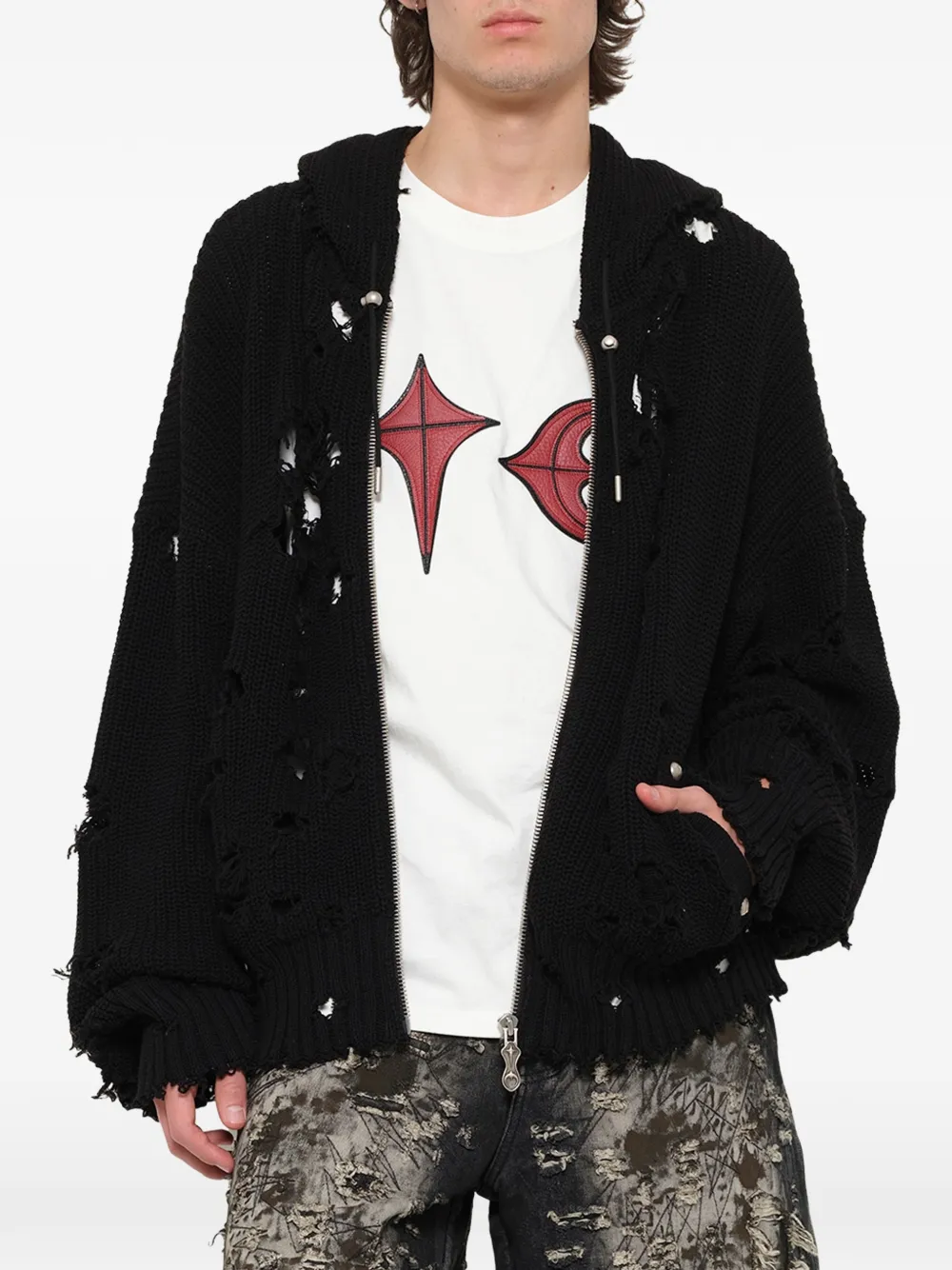 Black hoodie worn by a person, showing the hoodie fit