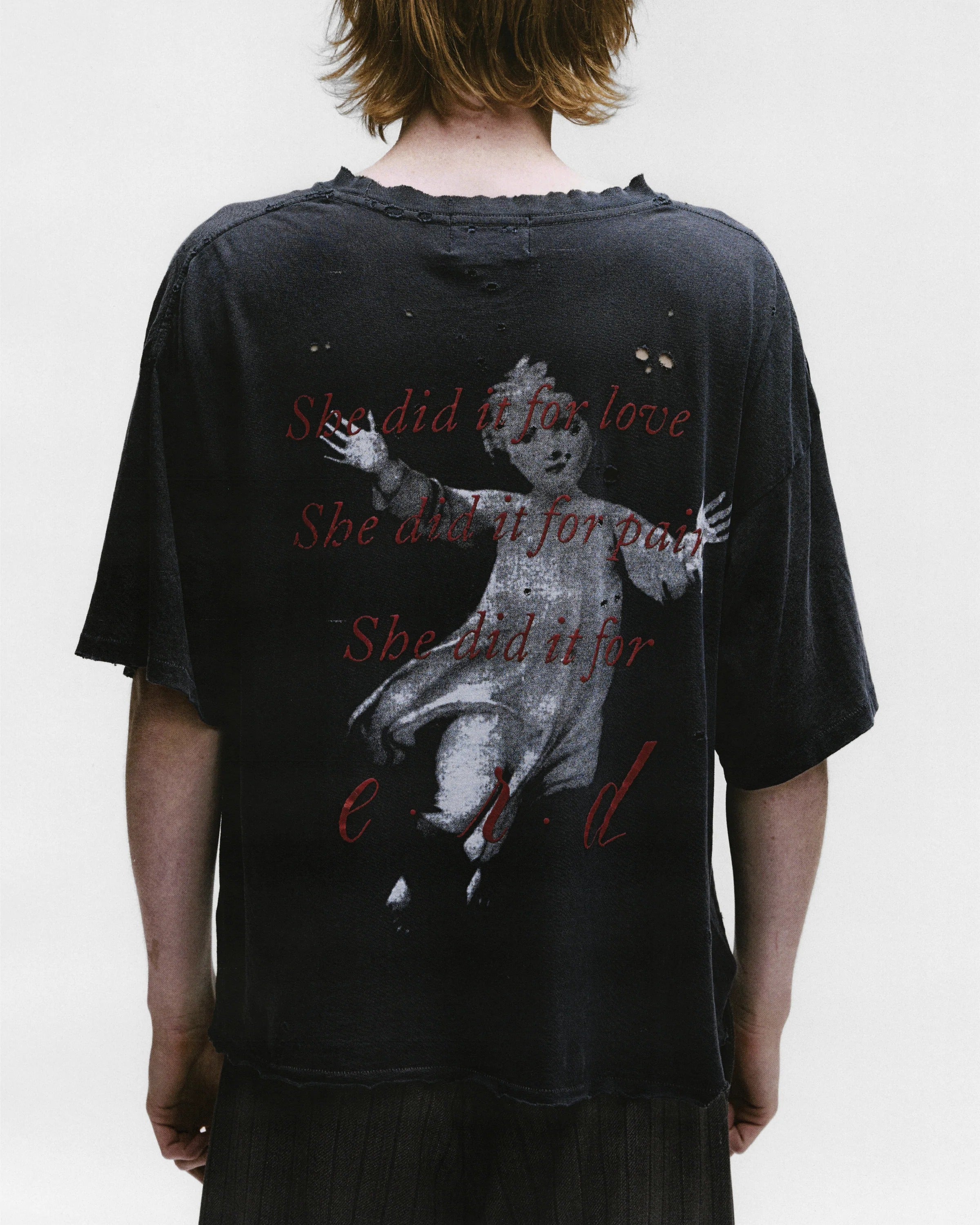 Black shirts worn by a person, showing the shirts fit