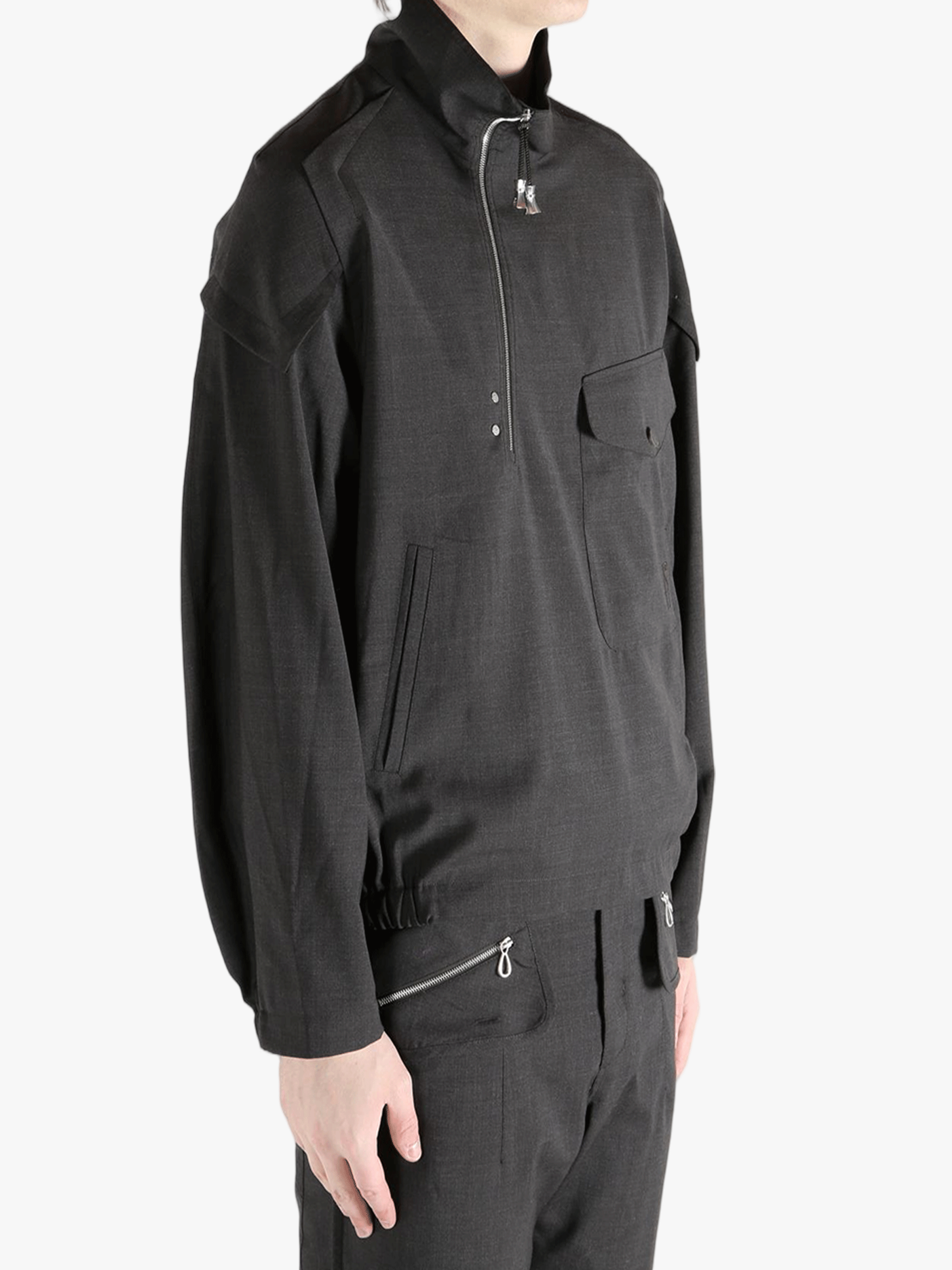 Black jackets-coats worn by a person, showing the jackets-coats's fit