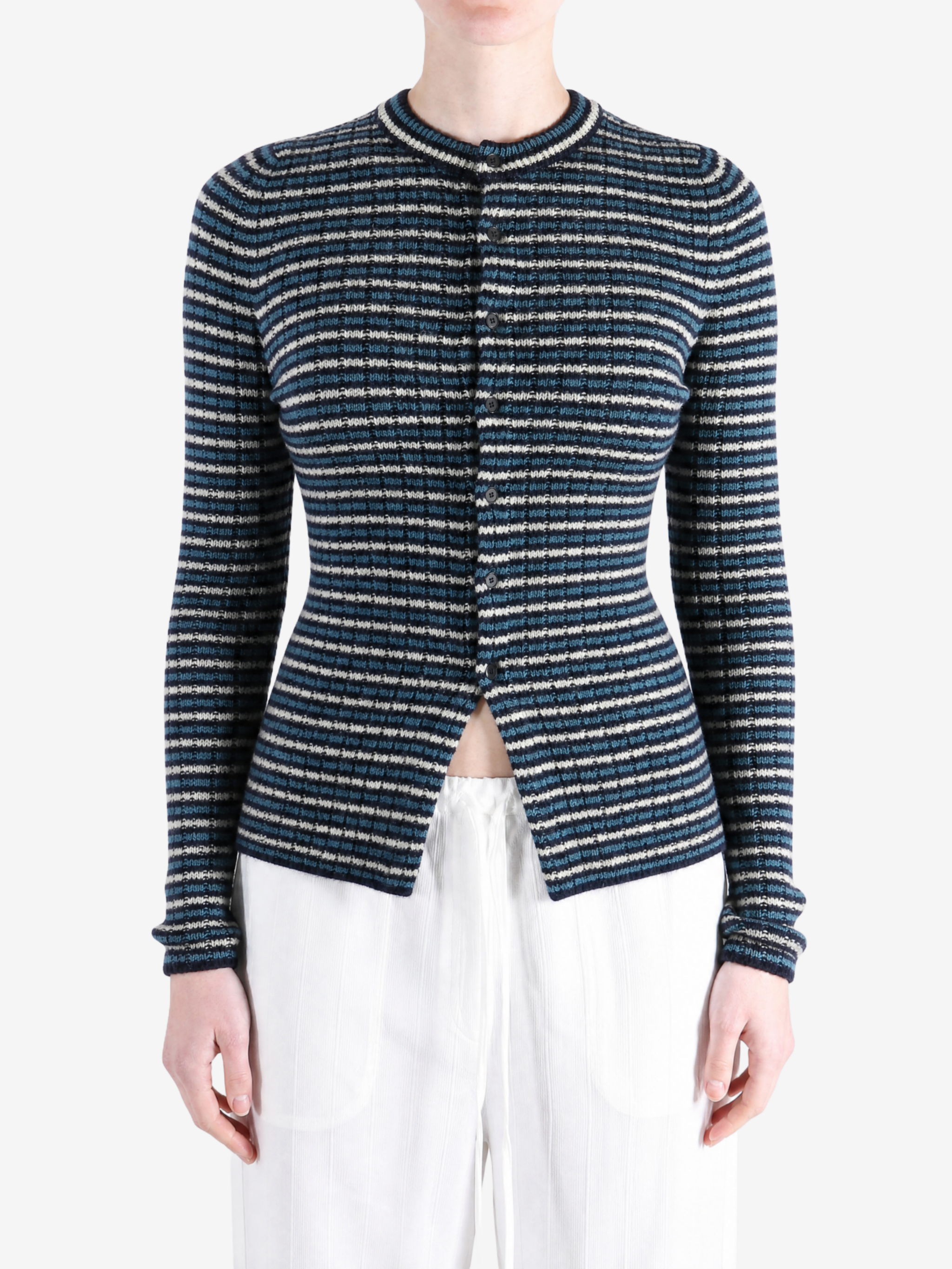 Navy knitwear worn by a person, showing the knitwear fit