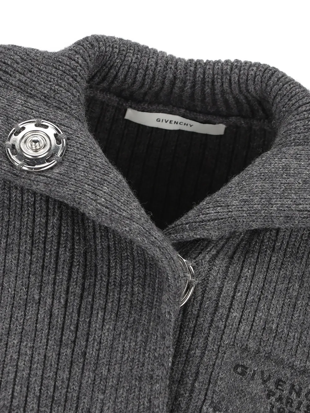 Close up of grey tops, showing texture of the wool and alpaca wool fabric