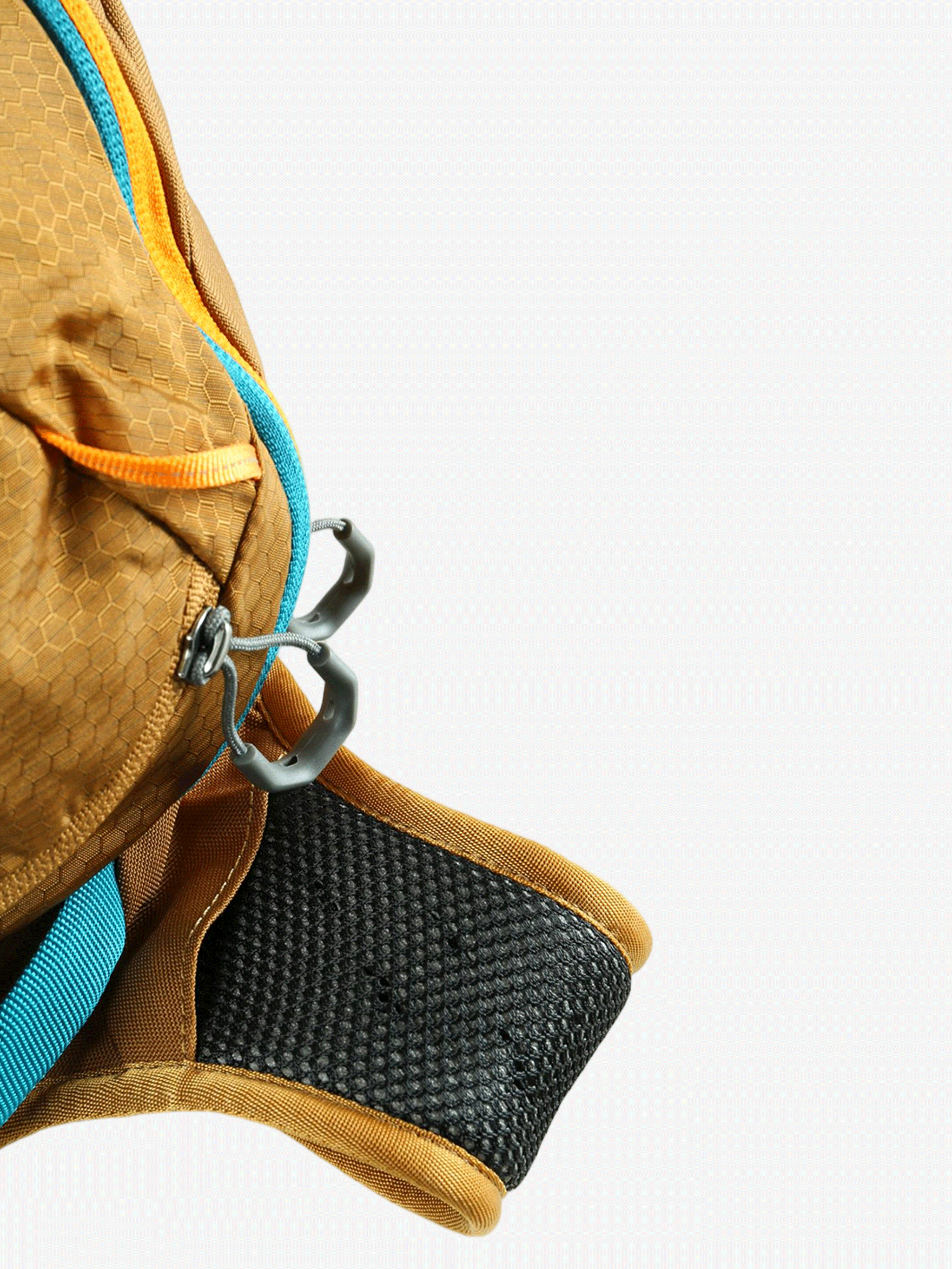 Close up of the tan backpack, showing texture of the polyester fabric