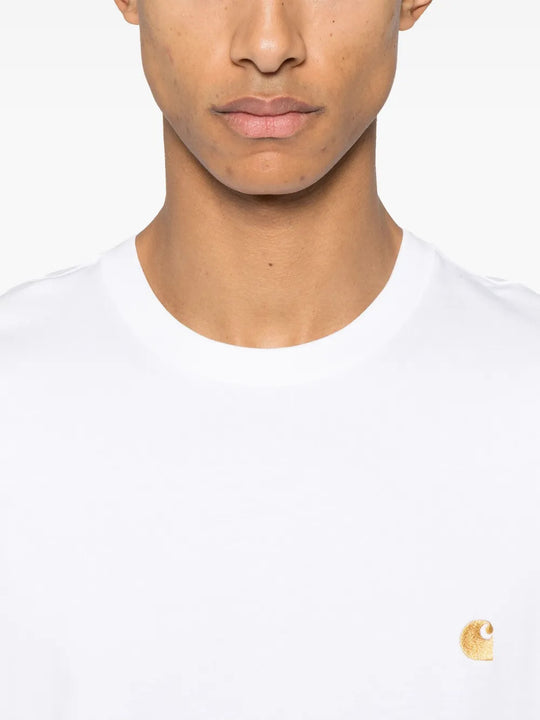 White t-shirt worn by a person, showing the t-shirt fit