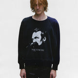 Black sweatshirt worn by a person, showing the sweatshirt's fit