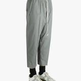 Grey pants worn by a person, showing the pants fit