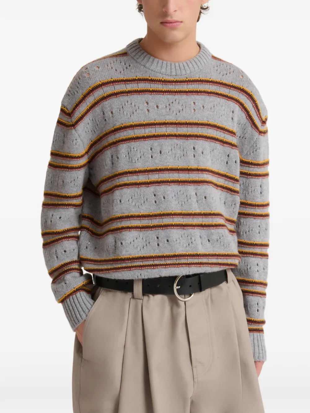 Grey knitwear worn by a person, showing the knitwear fit
