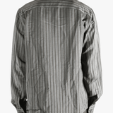 Grey shirt worn by a person, showing the shirt's fit