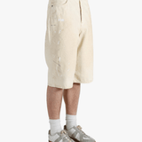 White shorts worn by a person, showing the shorts fit