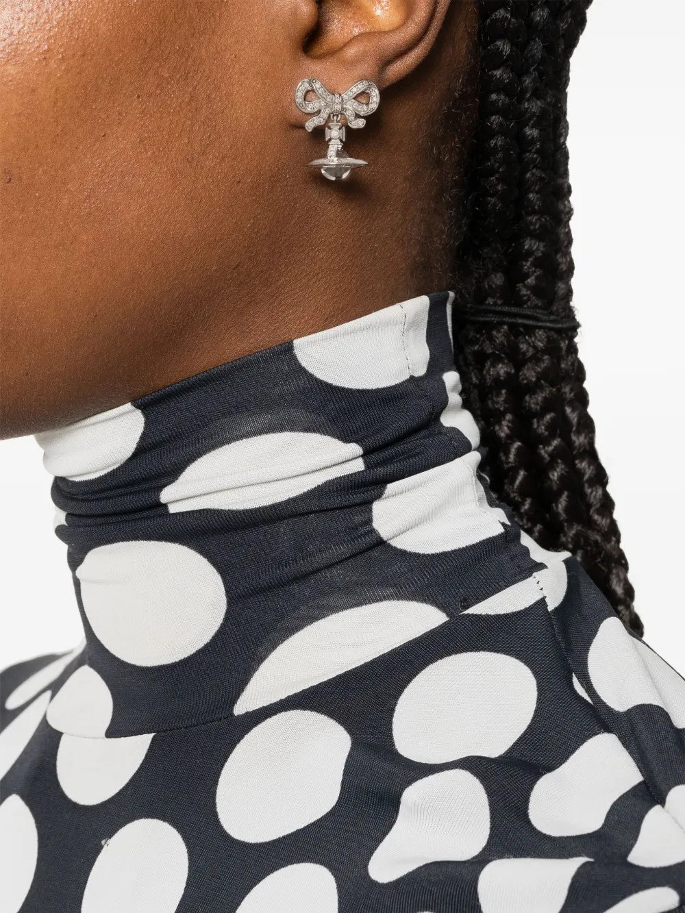 Grey accessories worn by a person, showing the accessories fit