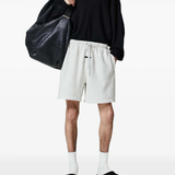 White shorts worn by a person, showing the shorts fit