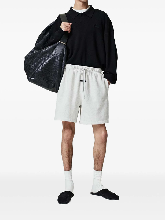 White shorts worn by a person, showing the shorts fit