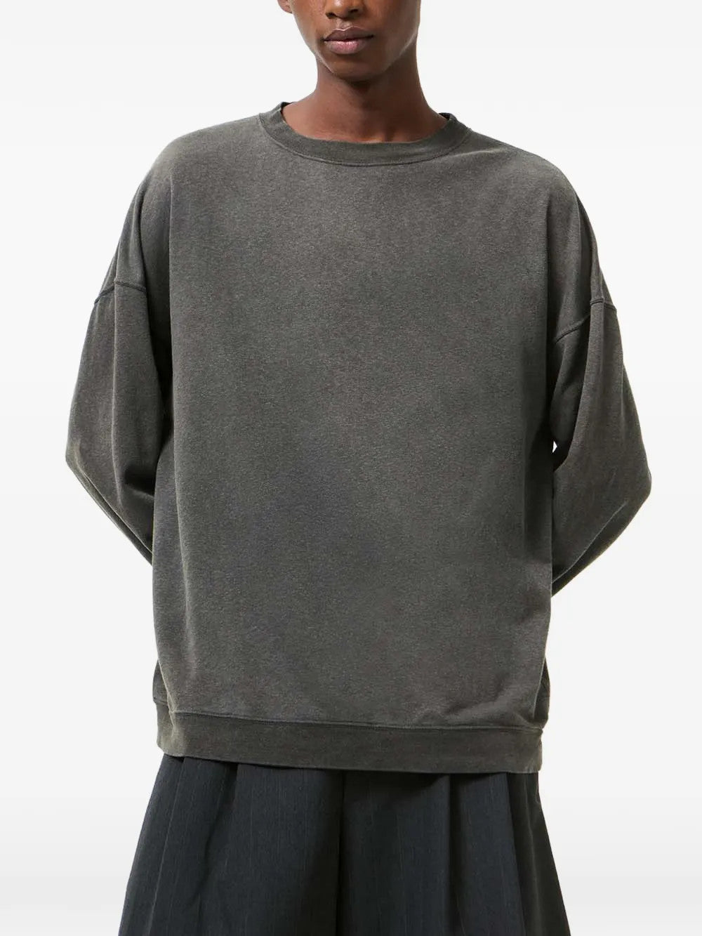 Grey hoodie worn by a person, showing the hoodie fit