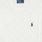 Cloes up of white knitwear, showing texture of cotton fabric