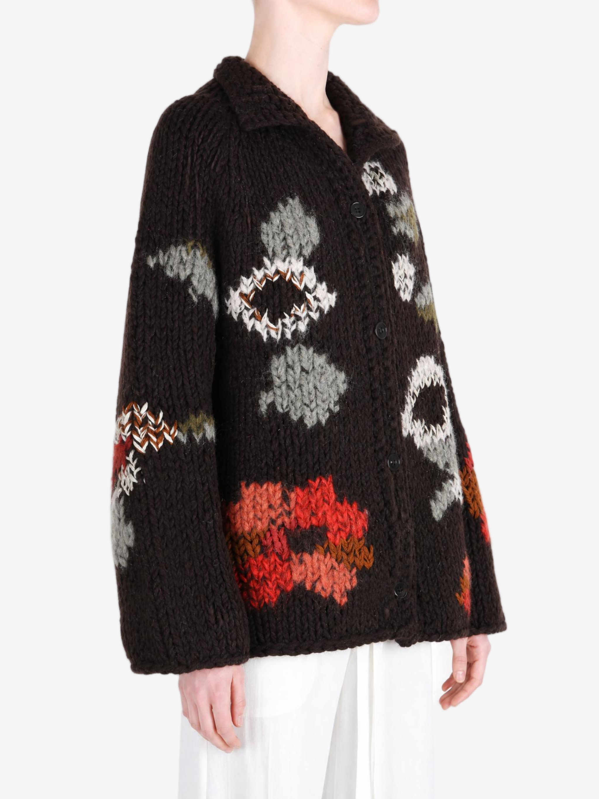 Brown knitwear worn by a person, showing the knitwear fit