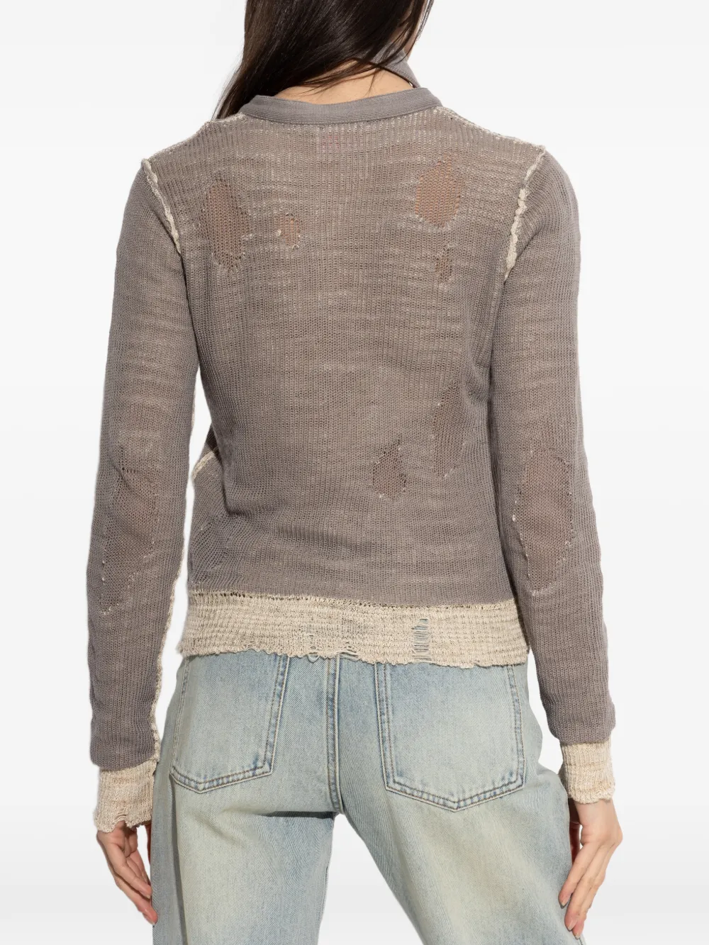 Grey top worn by a person, showing the top's fit