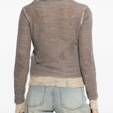 Grey top worn by a person, showing the top's fit
