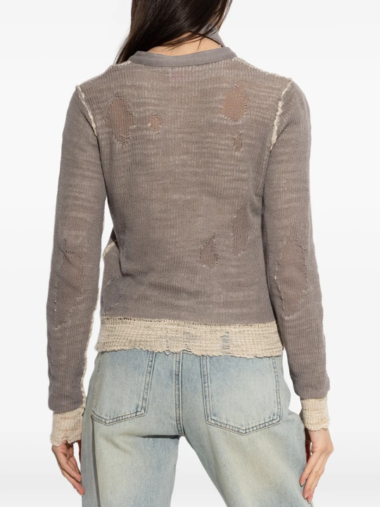 Grey top worn by a person, showing the top's fit