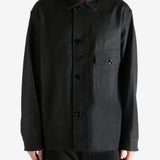 Black shirt worn by a person, showing the shirt's fit