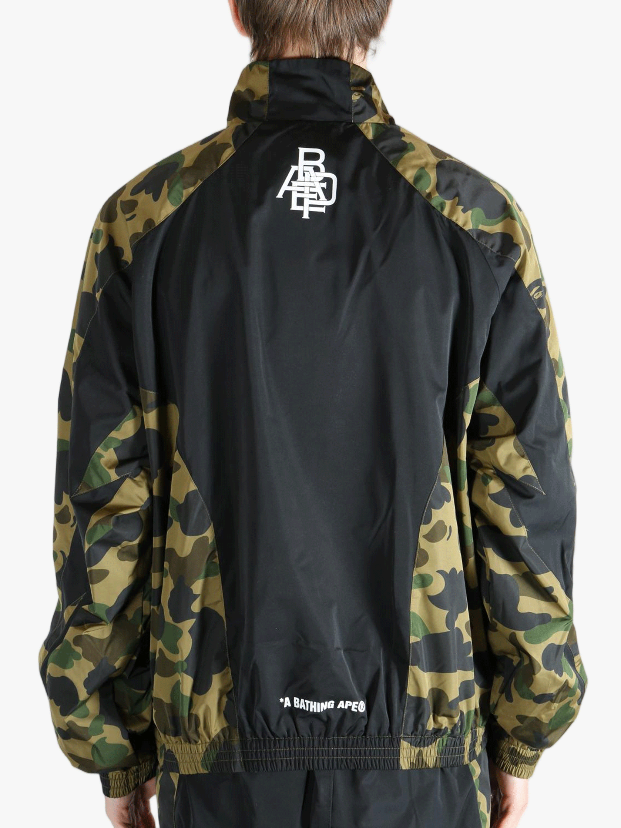 Green jacket worn by a person,showing the jacket's fit