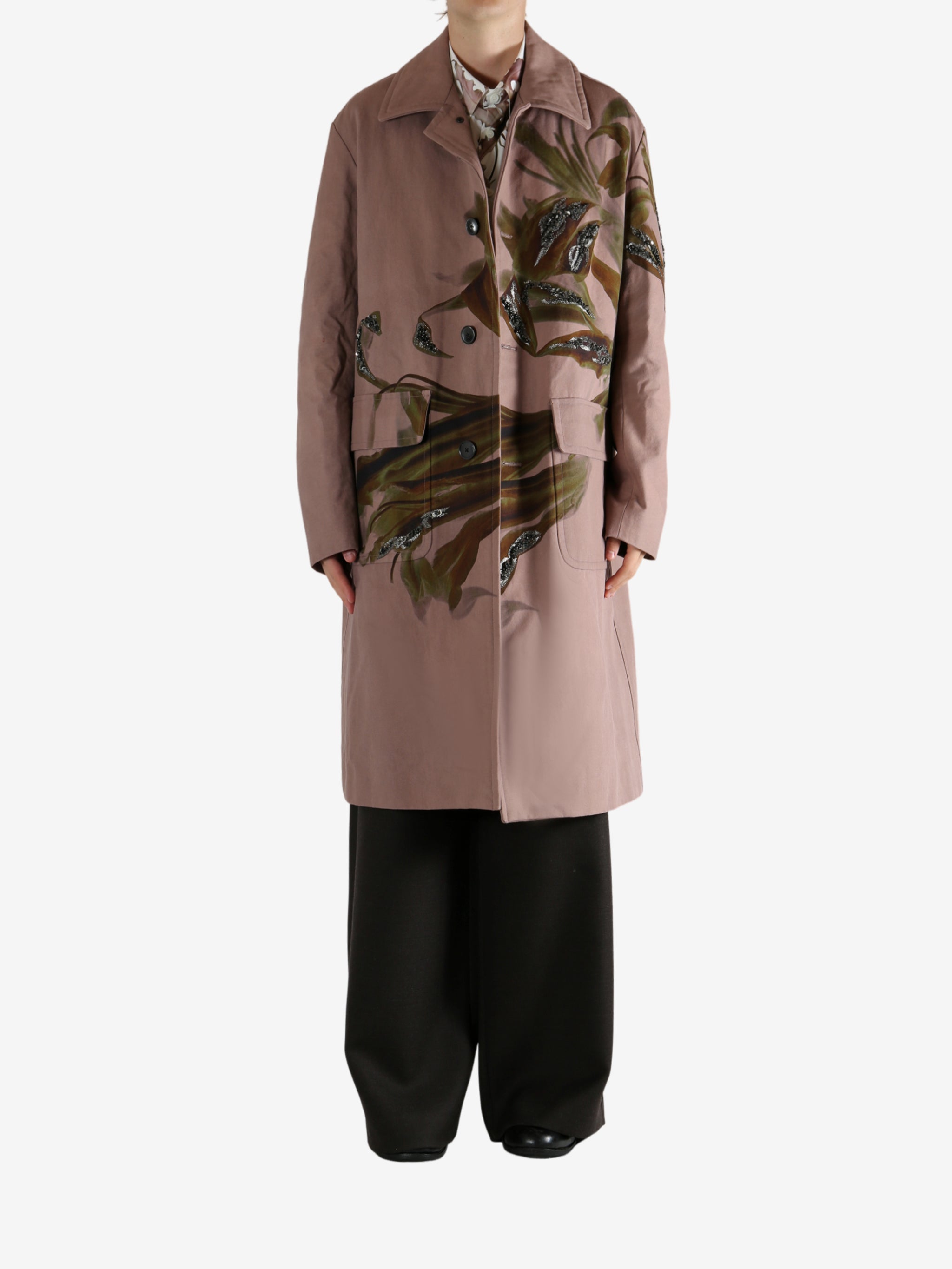 Pink coat worn by a person, showing the coat's fit