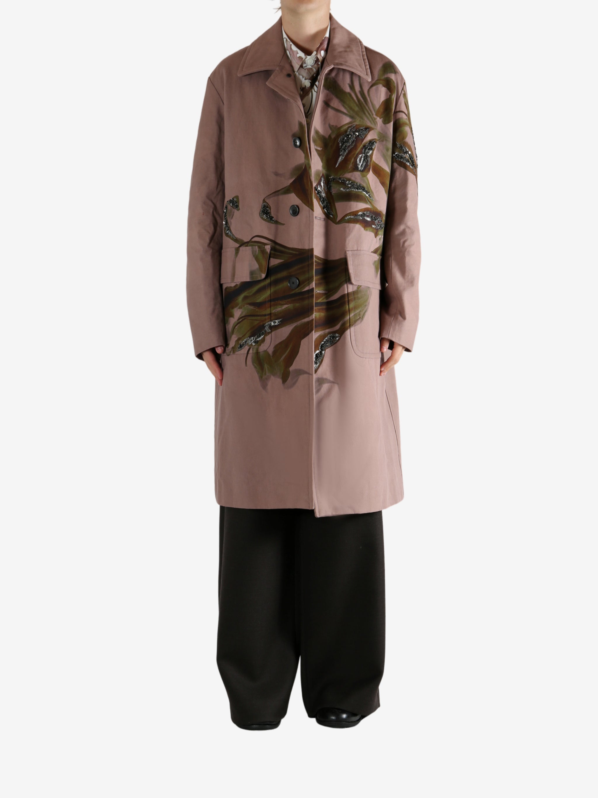 Pink coat worn by a person, showing the coat's fit