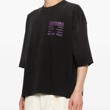 black t-shirt worn by a person, showing the t-shirt fit