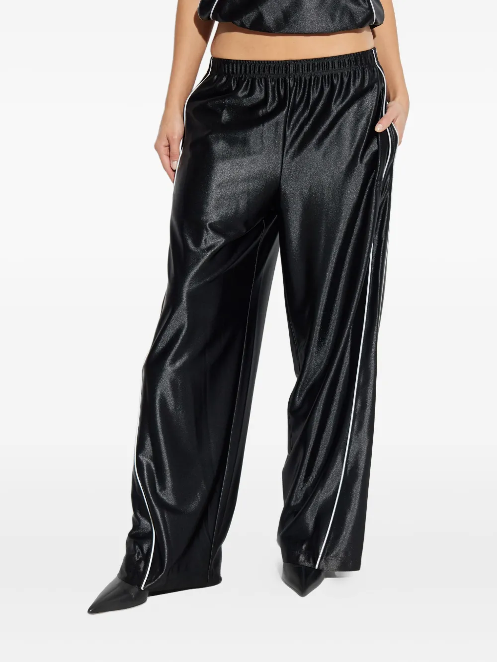 Black pants worn by a person, showing the pants fit