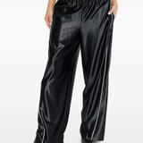 Black pants worn by a person, showing the pants fit