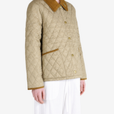 Tan jacket worn by a person, showing the jacket fit