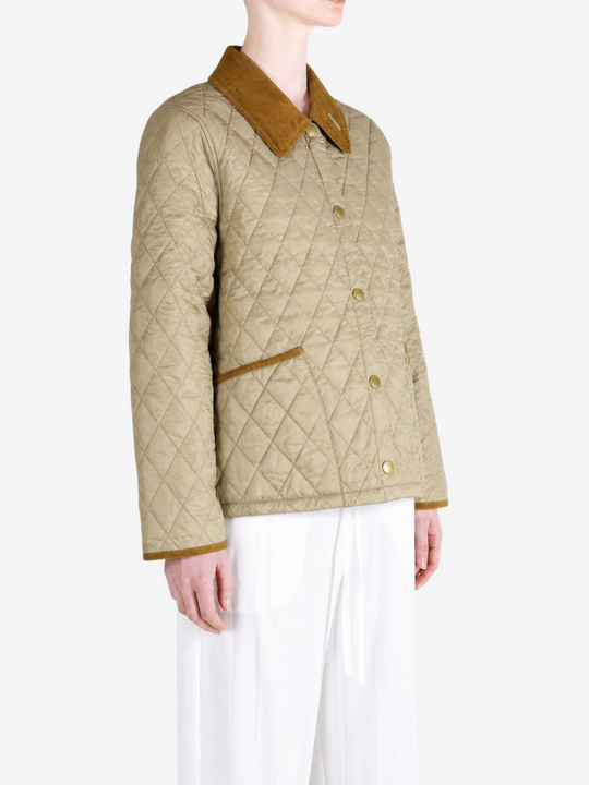 Tan jacket worn by a person, showing the jacket fit