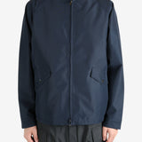 Navy jackets worn by a person, showing the jacket’s fit