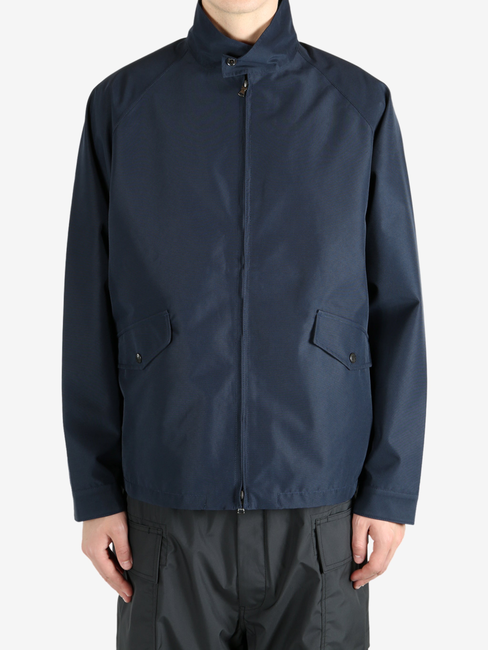 Navy jackets worn by a person, showing the jacket’s fit