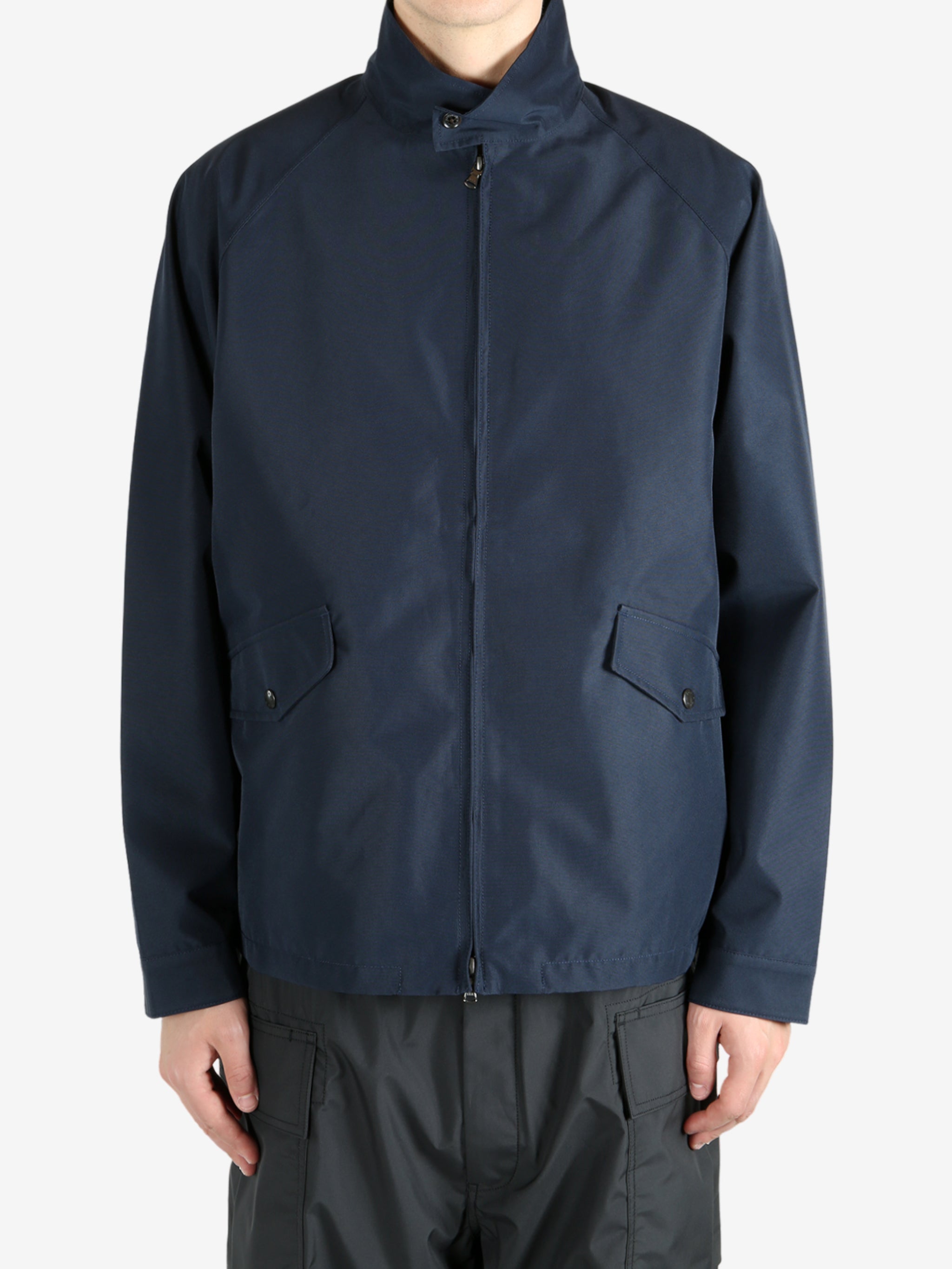 Navy jackets worn by a person, showing the jacket’s fit