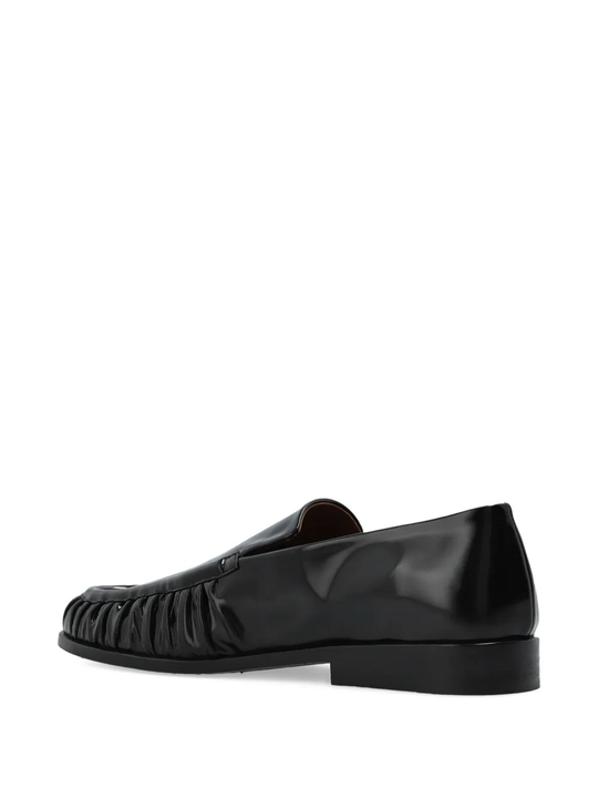 Black loafer, back view