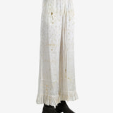 White pants worn by a person, showing the pants's fit