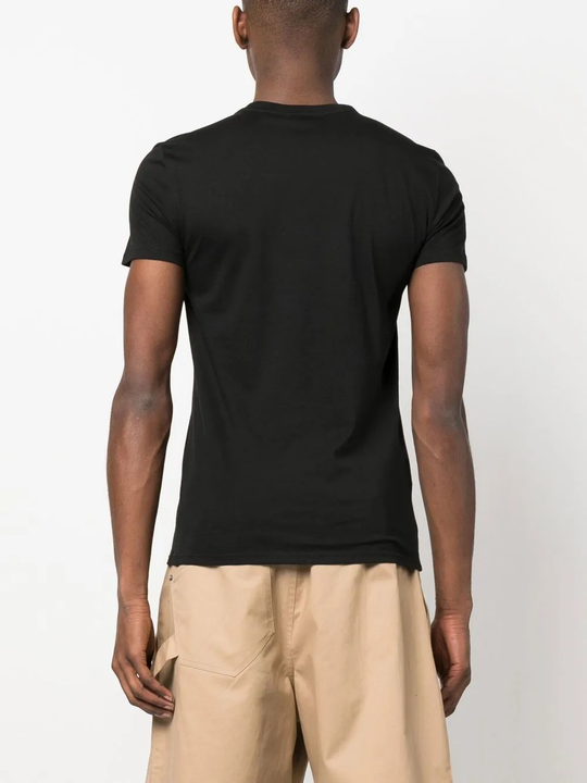 Black t-shirt worn by a person, showing the t-shirt's fit