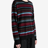 Black knitwear worn by a person, showing the knitwear fit
