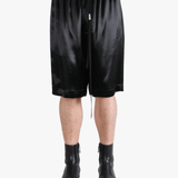 Black short worn by a person, showing the short fit