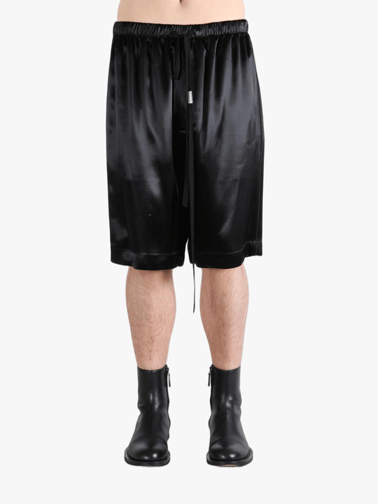 Black short worn by a person, showing the short fit