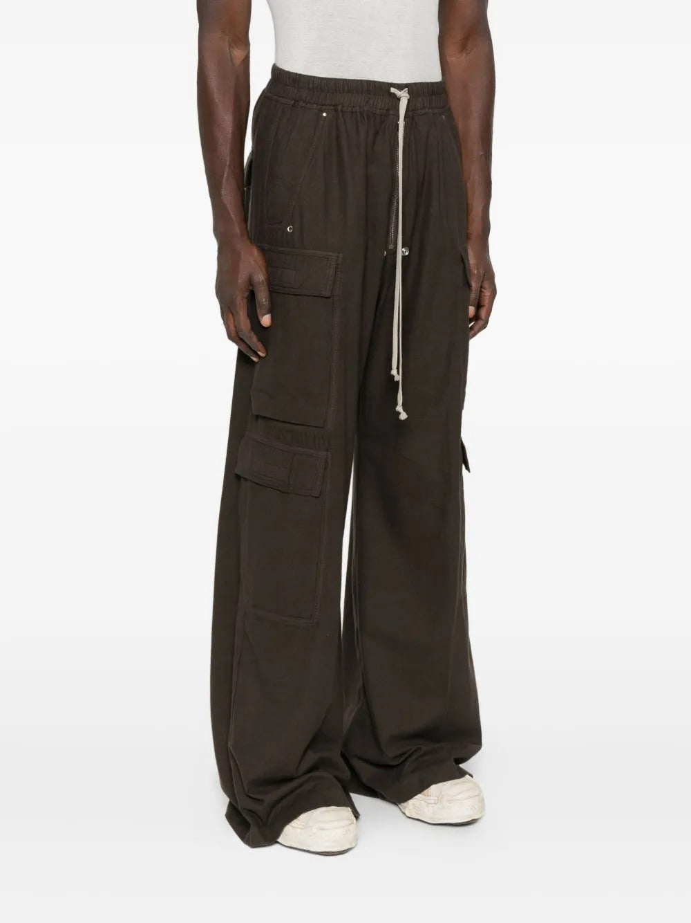 Brown pants worn by a person, showing the pants' fit