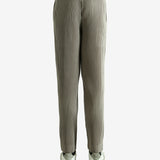 Grey pants worn by a person, showing the pants' fit