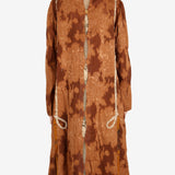 Orange coat worn by a person, showing the coat’s fit