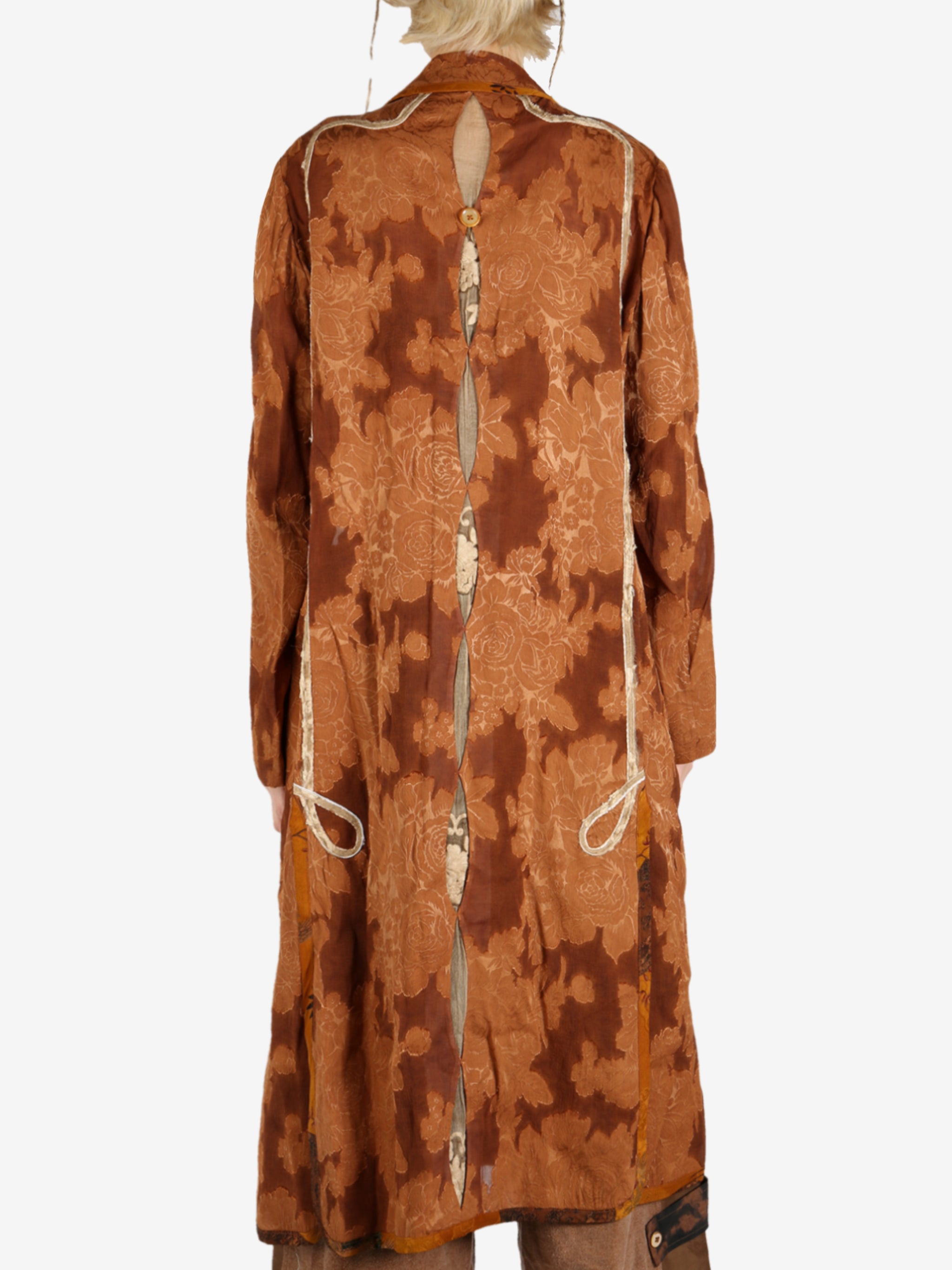 Orange coat worn by a person, showing the coat’s fit