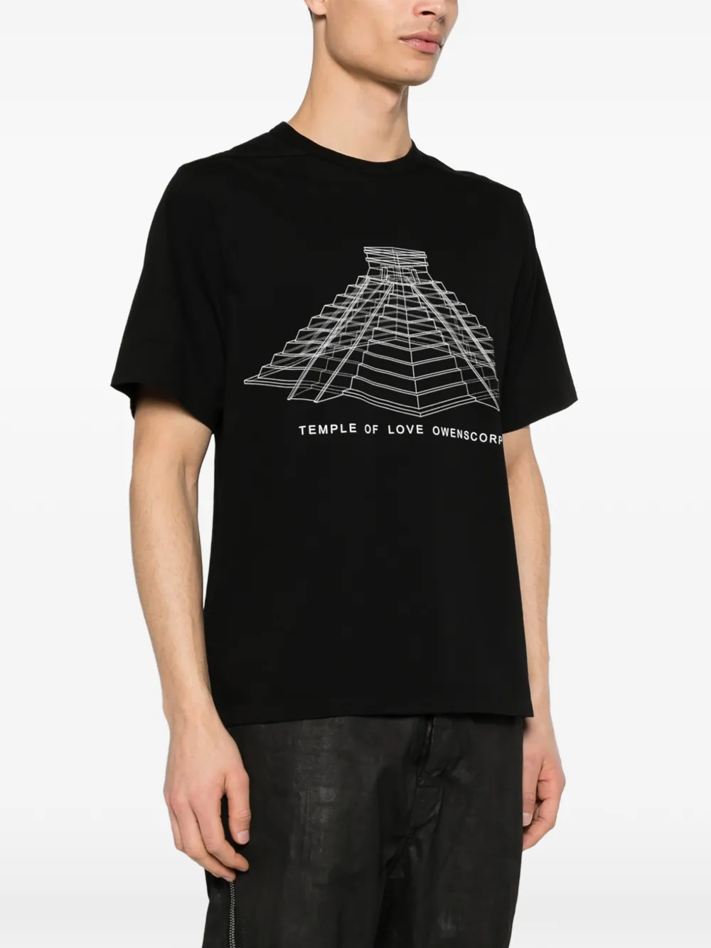 Black t-shirt worn by a person, showing the t-shirt's fit