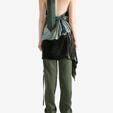 Green top, full body view