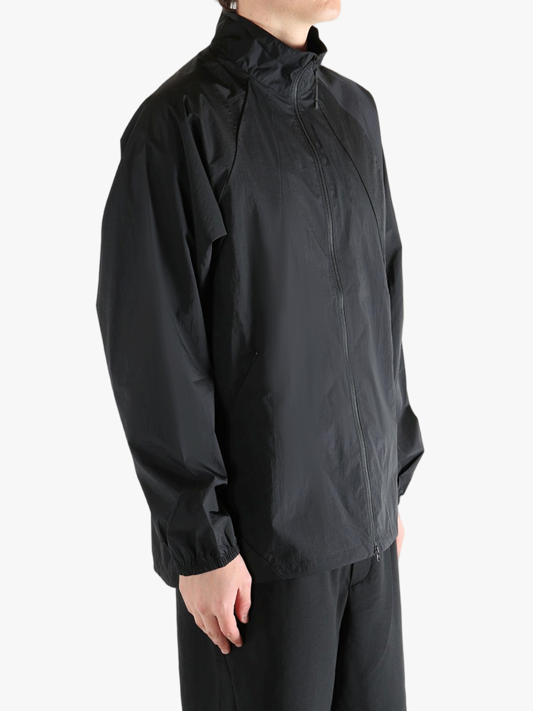 Black jacket worn by a person, showing the jacket's fit